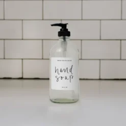Sweet Water Decor Clear Glass White Script Label Hand Soap Dispenser - 16oz -Bathroom Products Store GUEST b4b7a846 728c 4214 9520 763bc823ff0e